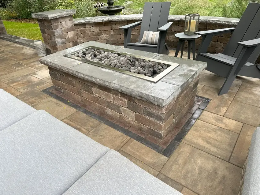 "Stylish patio installation in Elm Grove, WI, featuring a cozy gas firepit. This elegant setup enhances your outdoor living space, making it perfect for year-round gatherings and relaxation. #ElmGroveWI #PatioInstallation #GasFirepit #OutdoorLiving"