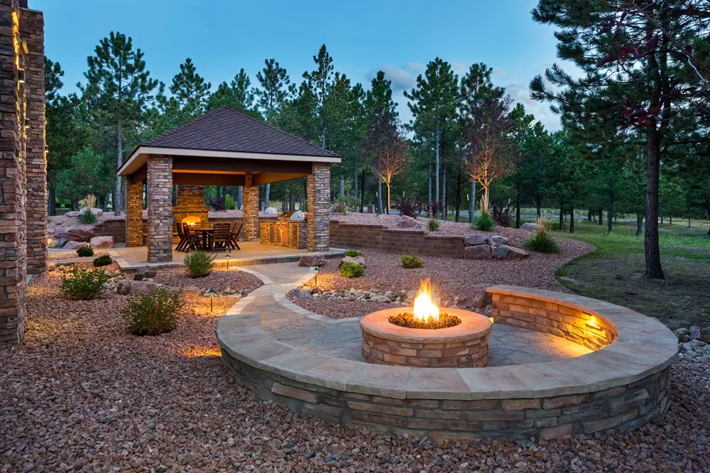 "Stunning outdoor living space featuring diverse retaining walls that seamlessly blend form and function. A perfect setting for relaxation and entertainment, enhanced by elegant hardscaping and lush surroundings. #OutdoorLiving #RetainingWalls #LandscapeDesign"