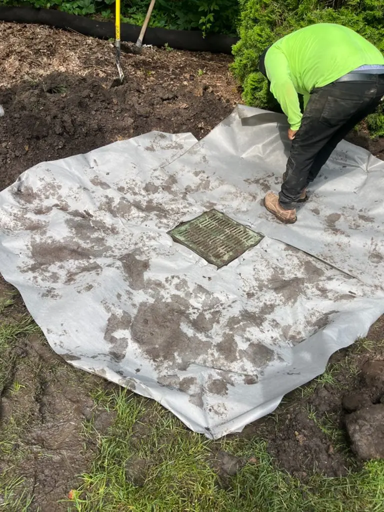 This image showcases a newly installed surface drain in Wauwatosa, Wisconsin, designed to address water management issues. The drain effectively captures and redirects excess surface water, preventing pooling and potential damage. This solution enhances drainage efficiency and helps protect the surrounding area from water-related problems, ensuring a well-maintained and functional outdoor space.