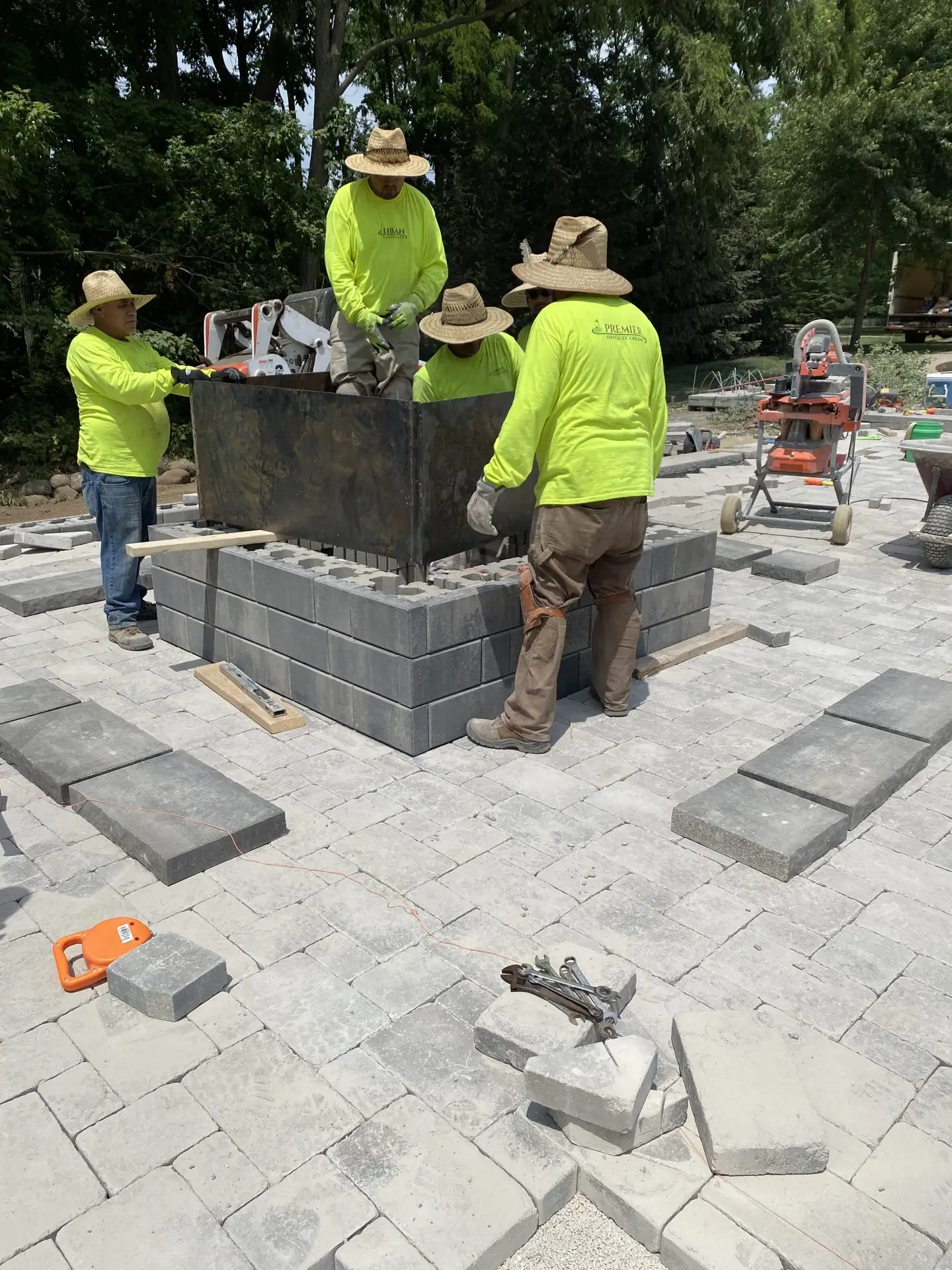 "Teamwork in action as we install a new patio firepit in Wisconsin. This collaborative effort transforms outdoor spaces into cozy, inviting areas for gatherings and relaxation. #Wisconsin #PatioFirepit #Teamwork #OutdoorLiving"